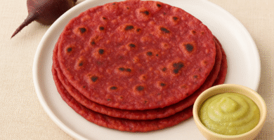 Colorful beetroot roti for babies on a plate with small pieces cut for 1 year old toddlers