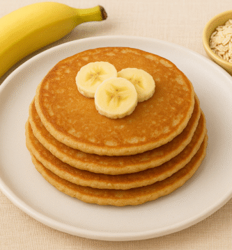 Easy banana oats pancakes for babies cut into finger-friendly strips on a colorful plate, perfect for baby led weaning and first foods
